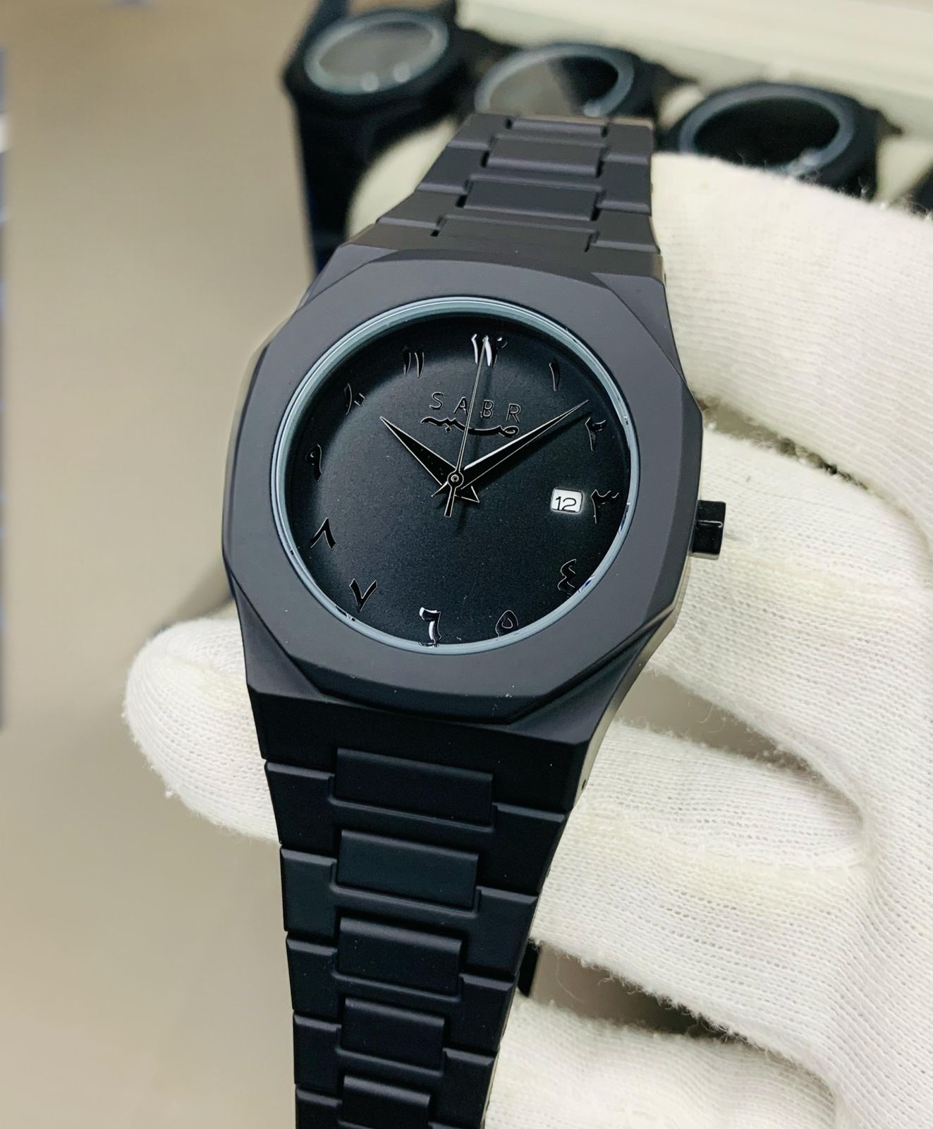 black sabr aura watch with date